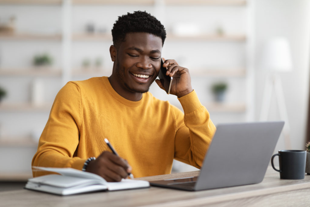 man sitting smiling at table